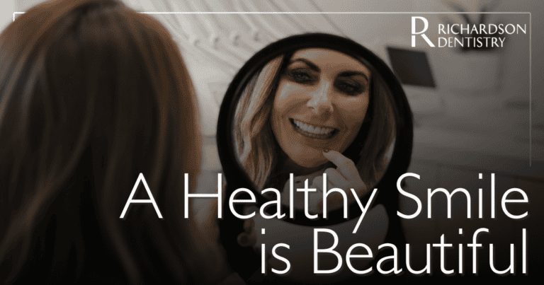 A Healthy Smile is Beautiful female patient smiling in the mirror
